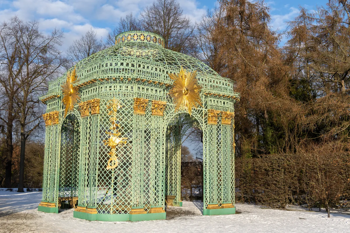 Gilded trellis pavilion in the snow, Sanssouci Park, Germany — Nicolas Marincic