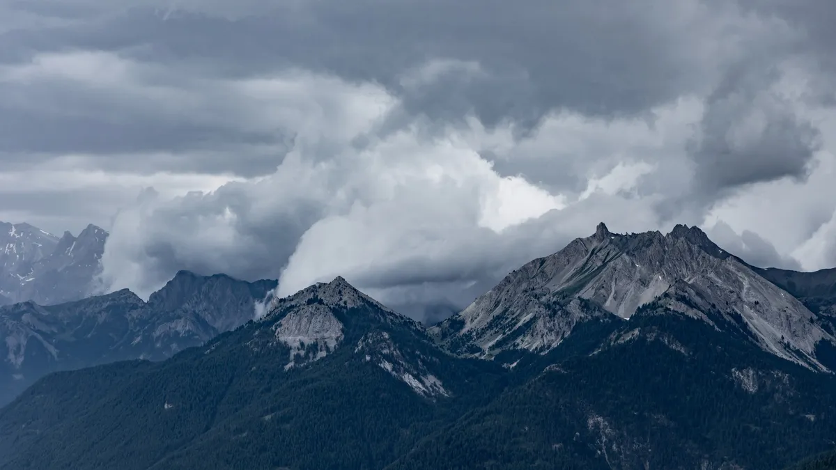Alpine peaks under a heavy sky — Nicolas Marincic