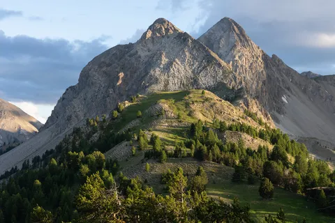 Twin summits above the alpine pastures — Nicolas Marincic