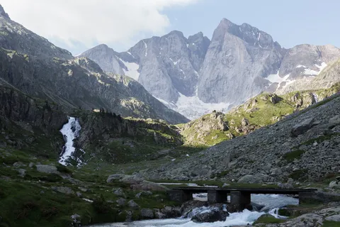 Waterfall and stone bridge below the glaciers — Nicolas Marincic