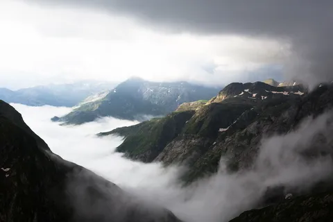 Mist pouring into a valley — Nicolas Marincic