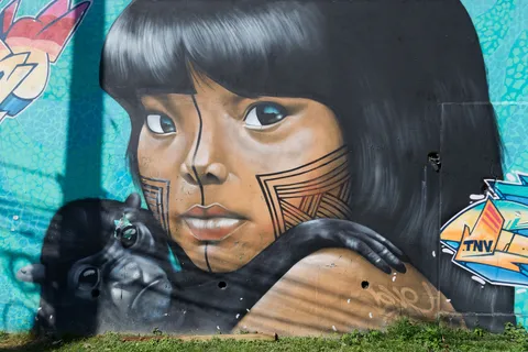Street mural of an Indigenous girl, Manaus, Brazil — Nicolas Marincic