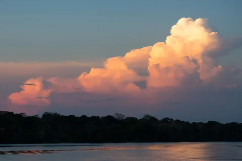 Cumulus at sunset over the Solimões, Brazil — Nicolas Marincic