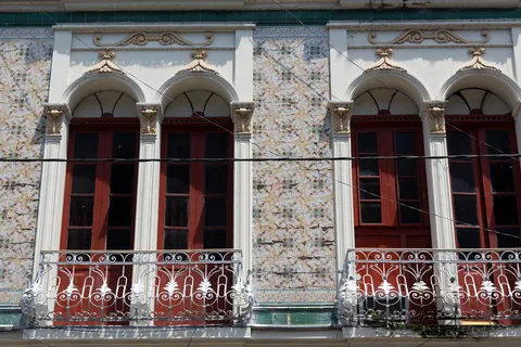 Rubber-boom azulejo facade, Iquitos, Peru — Nicolas Marincic