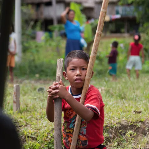 Boy with a pole in a village on the Napo, Peru — Nicolas Marincic