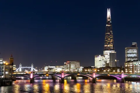 The Shard and Tower Bridge across the Thames at night, United Kingdom — Nicolas Marincic