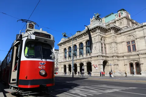 Red tram passing the State Opera, Vienna, Austria — Nicolas Marincic
