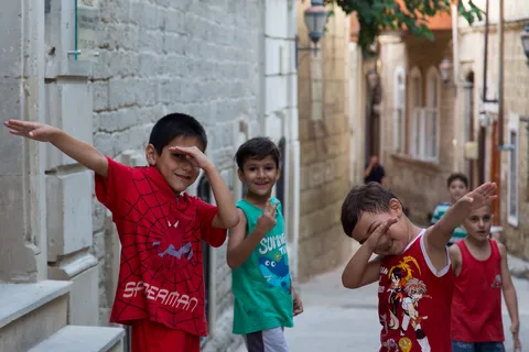 Children playing in an old-town lane, Azerbaijan — Nicolas Marincic