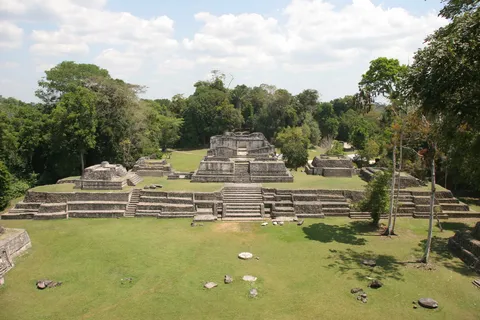 Maya plaza and temples at the forest’s edge, Belize — Nicolas Marincic