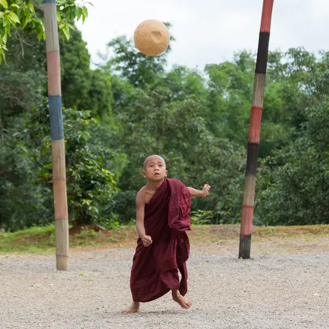 Young novice playing ball, Burma — Nicolas Marincic