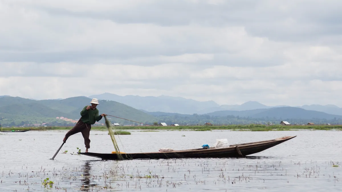 Leg-rowing fisherman on Inle Lake, Burma — Nicolas Marincic