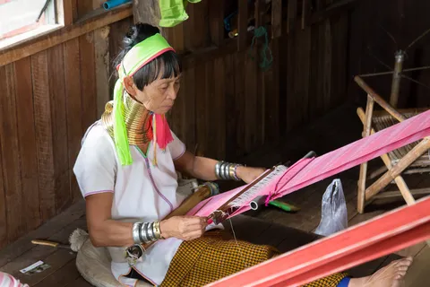 Kayan woman weaving at her loom, Burma — Nicolas Marincic