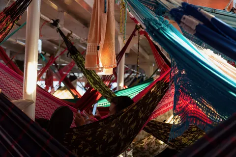 Hammocks aboard a riverboat, Brazil — Nicolas Marincic