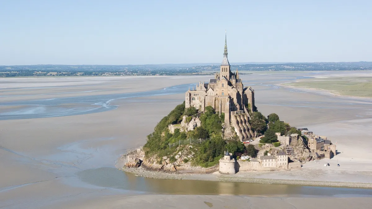 Mont-Saint-Michel on the sands at low tide, from the air, France — Nicolas Marincic