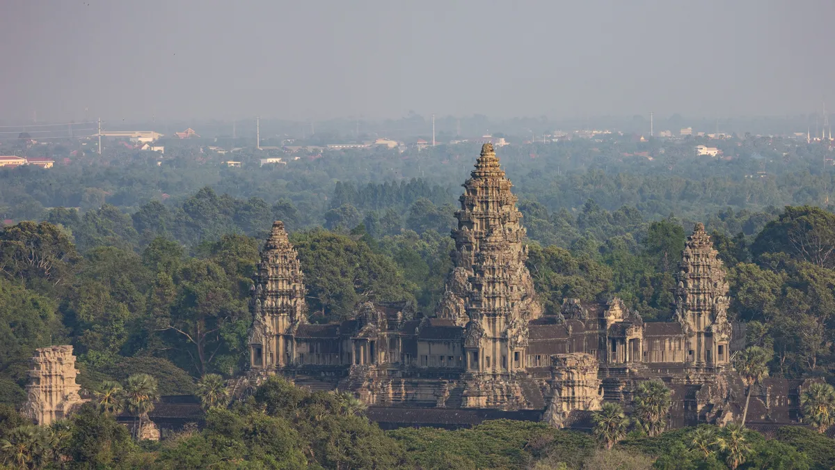 Angkor Wat above the jungle from Phnom Bakheng, Cambodia — Nicolas Marincic