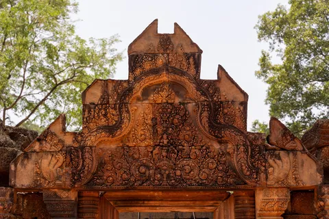 Pink sandstone pediment at Banteay Srei, Cambodia — Nicolas Marincic