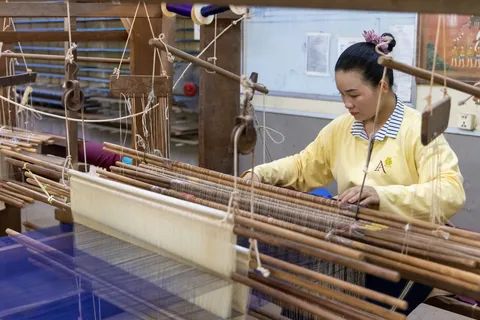 Silk weaver at her loom, Siem Reap, Cambodia — Nicolas Marincic