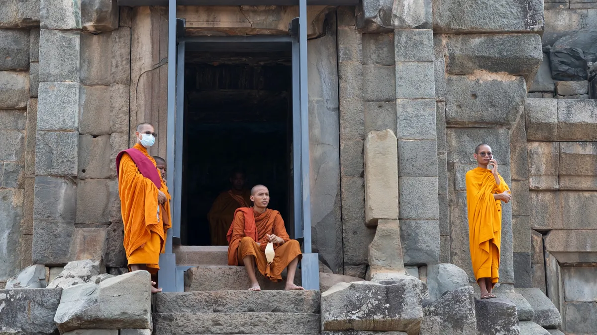Monks resting in a temple doorway, Cambodia — Nicolas Marincic