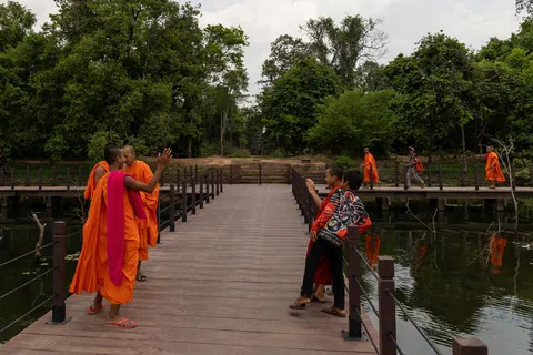 Monks on a wooden walkway, Cambodia — Nicolas Marincic