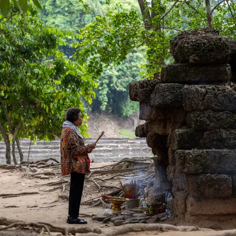 Praying at a shrine among the ruins, Cambodia — Nicolas Marincic
