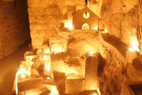 Carved miniature village in the catacombs, France — Nicolas Marincic
