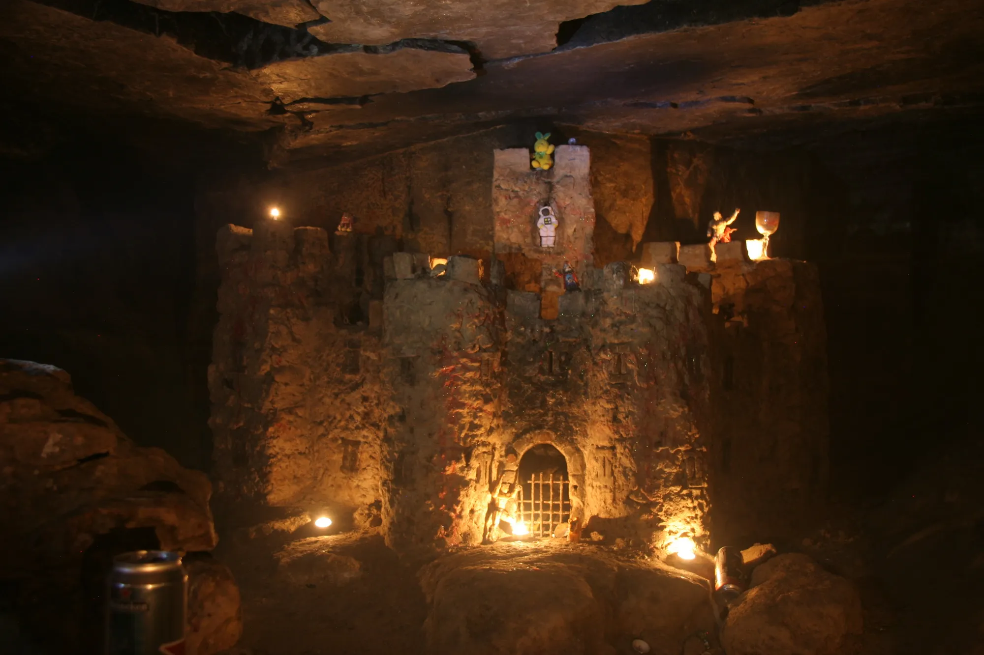 Carved castle by candlelight in the catacombs, France — Nicolas Marincic