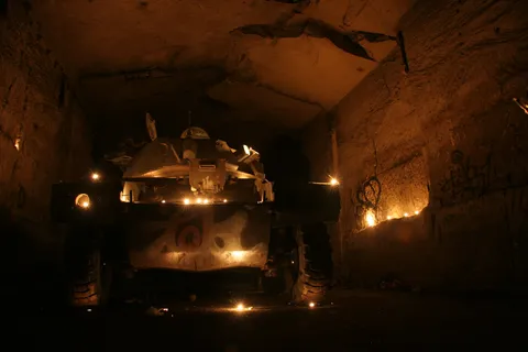 Armoured car lit by candles, NATO bunker, France — Nicolas Marincic