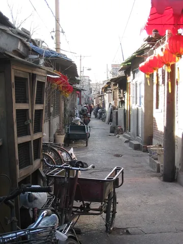 Hutong with tricycles and red lanterns, Beijing, China — Nicolas Marincic
