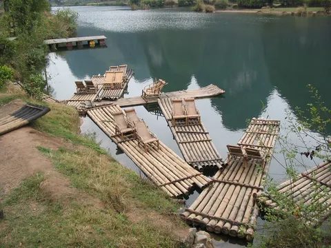 Bamboo rafts moored on the Yulong River, China — Nicolas Marincic