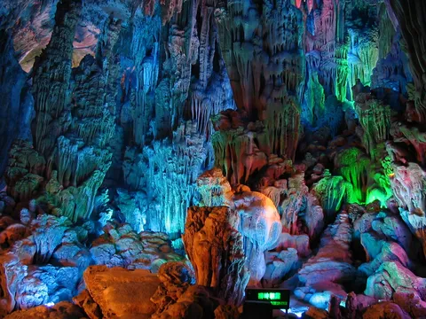 Coloured formations in Reed Flute Cave, China — Nicolas Marincic