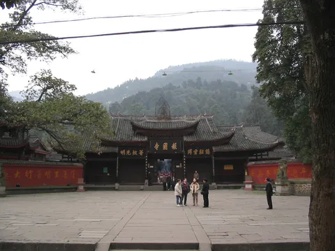 Temple forecourt below wooded hills, China — Nicolas Marincic
