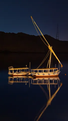 Feluccas reflected at night, Aswan, Egypt — Nicolas Marincic