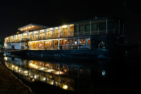 The steamship Sudan lit up at night, with reflection, Egypt — Nicolas Marincic