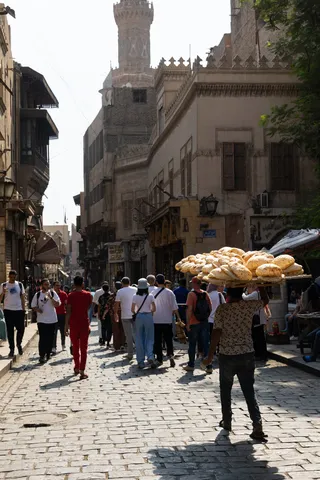 Bread carrier in a cobbled street, Egypt — Nicolas Marincic
