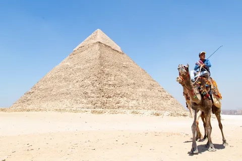 Camel rider before the Pyramid of Khafre, Egypt — Nicolas Marincic