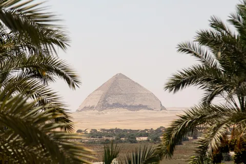 Bent Pyramid of Dahshur framed by palms, Egypt — Nicolas Marincic