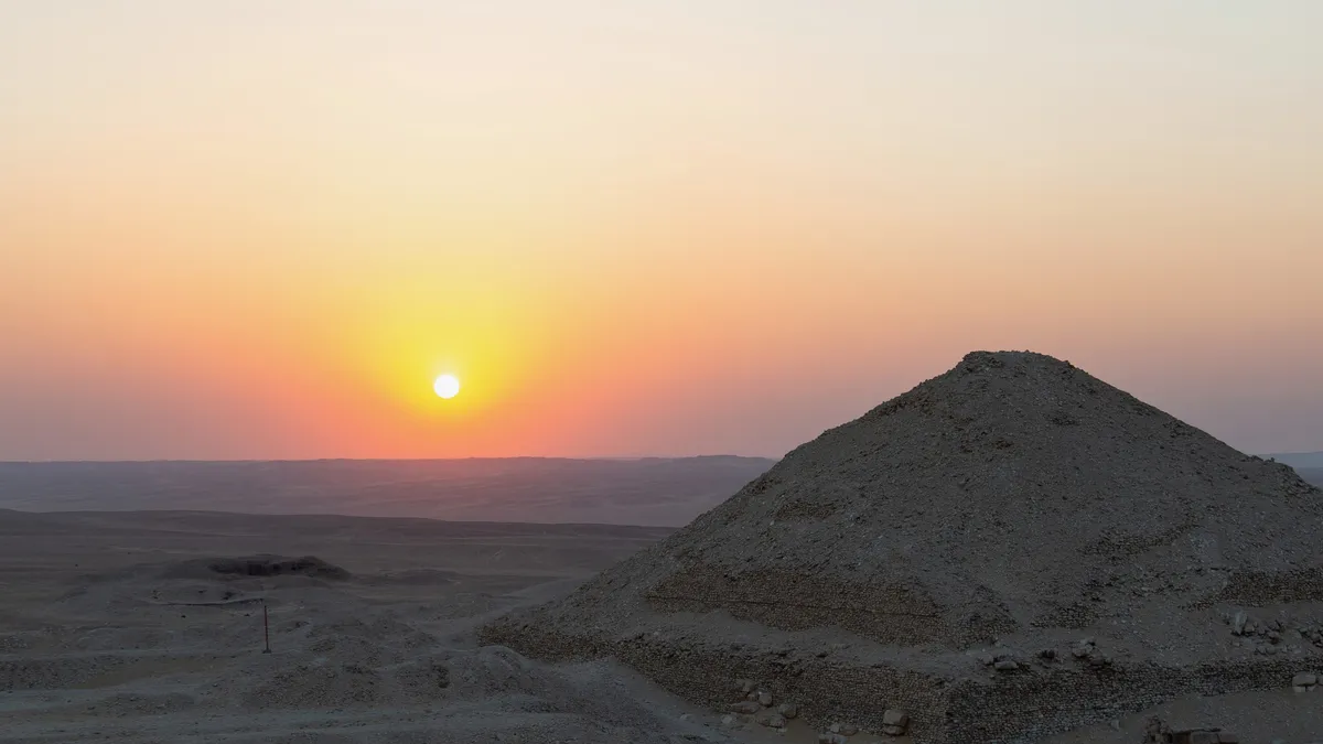 Sun setting over a ruined pyramid, Egypt — Nicolas Marincic