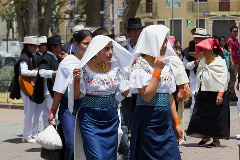 Women in embroidered blouses at a festival, Ecuador — Nicolas Marincic