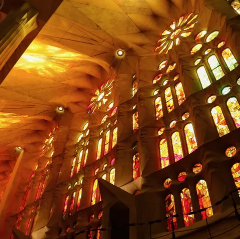 Sagrada Família nave aglow with stained-glass light, Spain — Nicolas Marincic