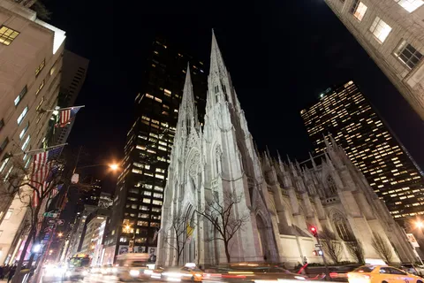 St Patrick’s Cathedral at night among skyscrapers, United States — Nicolas Marincic