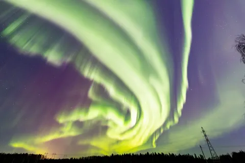 Aurora spiral over the forest, Lapland, Finland — Nicolas Marincic