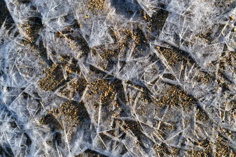 Motifs de glace sur un lac gelé, Finlande — Nicolas Marincic