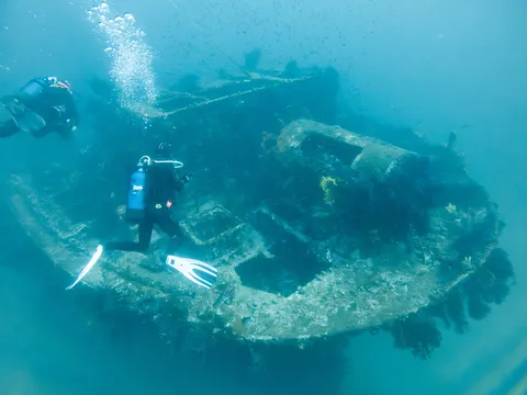 Divers above a wreck, France — Nicolas Marincic