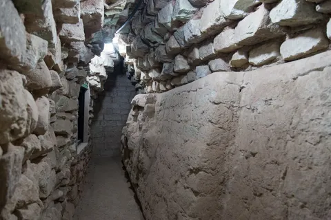 Archaeological tunnel beneath the Acropolis, Copán, Honduras — Nicolas Marincic
