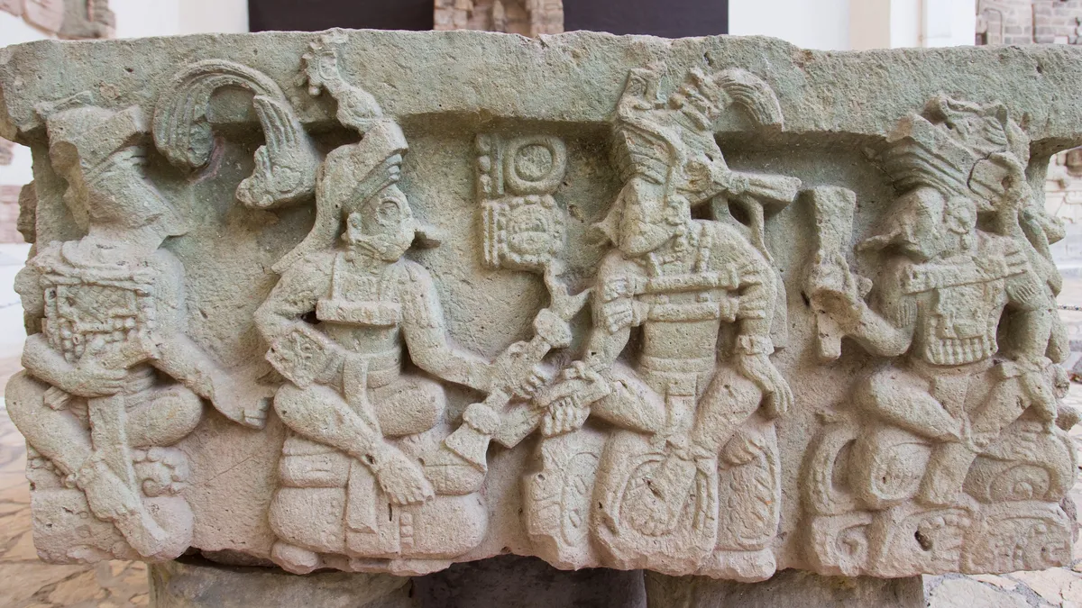 Carved bench with seated figures, Copán Sculpture Museum, Honduras — Nicolas Marincic