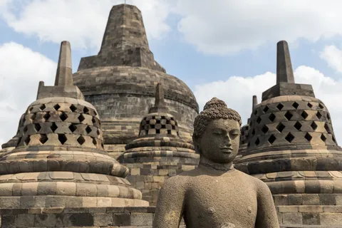 Buddha among the latticed stupas, Borobudur, Indonesia — Nicolas Marincic