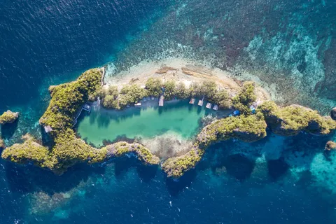 Ring-shaped island with inner lagoon, Raja Ampat, Indonesia — Nicolas Marincic