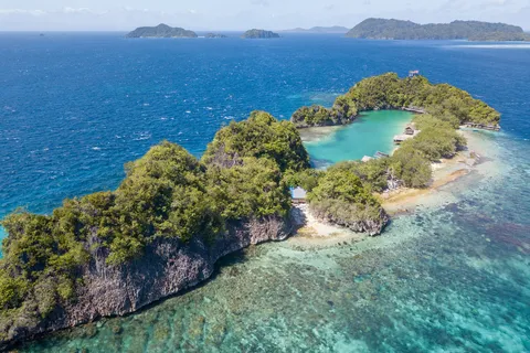 Island, hidden lagoon and reef from above, Raja Ampat, Indonesia — Nicolas Marincic