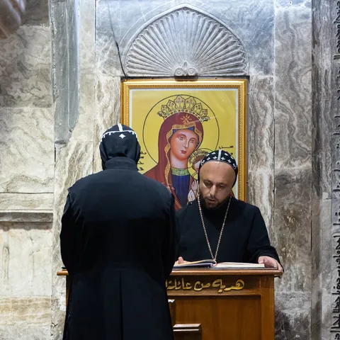 Priest reading before an icon of the Virgin, Iraq (Kurdistan) — Nicolas Marincic