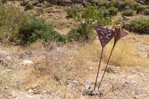 Signs marking a minefield, Iraq (Kurdistan) — Nicolas Marincic